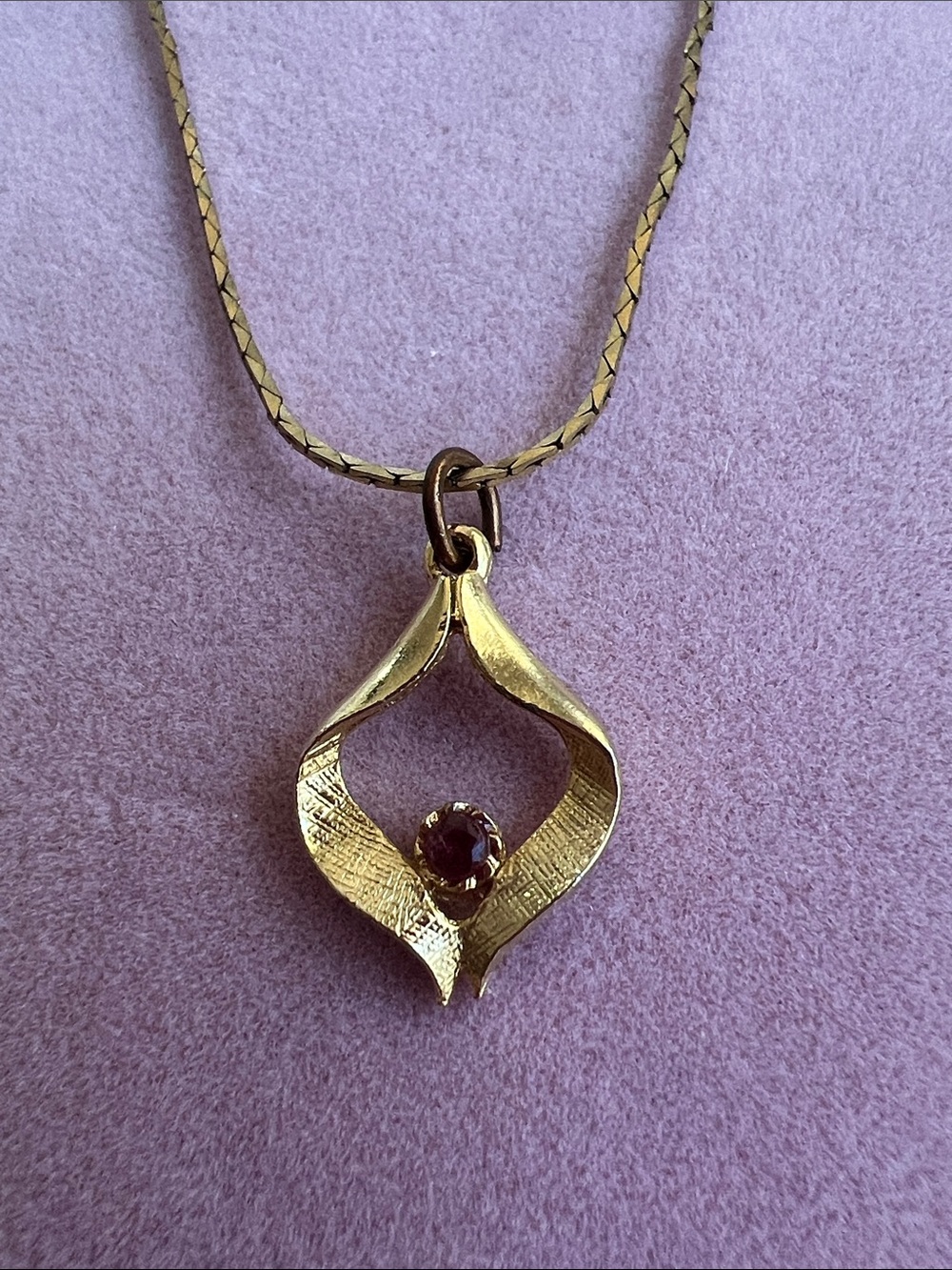 Gold-Tone Leaf Sculpted Pendant Necklace with Red Gem
